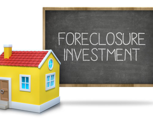 Foreclosure investment on blackboard with 3d house front of blackboard on white background
