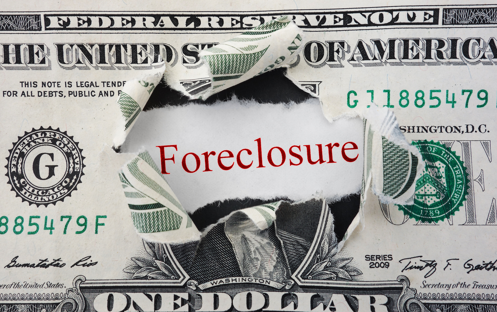 Foreclosure text in red with ripped dollar bill